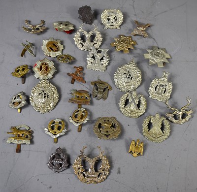 Lot 282 - A group of WWI and later military cap badges...