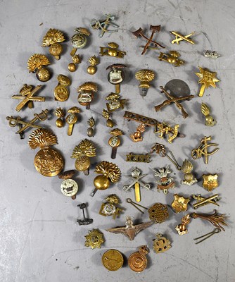 Lot 279 - A group of WWI and later military cap, collar...