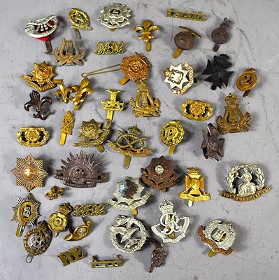 Lot 280 - A group of WWI and later military cap badges...