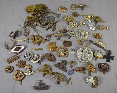 Lot 281 - A group of WWI and later military cap badges...