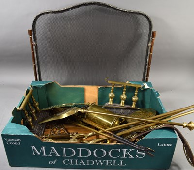 Lot 521 - A group of brassware to include fire irons,...