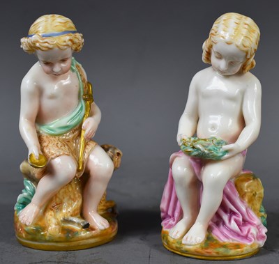 Lot 245 - Twso 19th century porcelain putti figures, the...