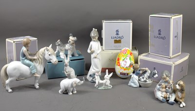 Lot 236 - A group of Lladro and Nao boxed porcelain...