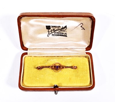 Lot 76 - A 9ct gold and amethyst bar brooch in the...