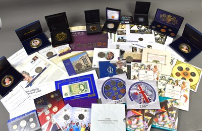 Lot 31 - A group of coins and coin presentation packs...