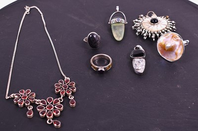 Lot 68 - A silver and garnet pendant necklace, together...