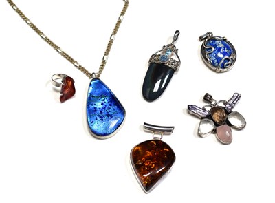 Lot 73 - A group of five pendants to include white...