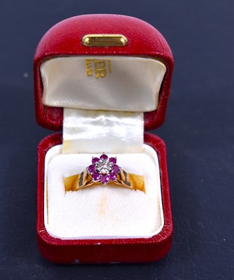 Lot 85 - A 9ct gold, ruby and diamond flowerhead ring,...