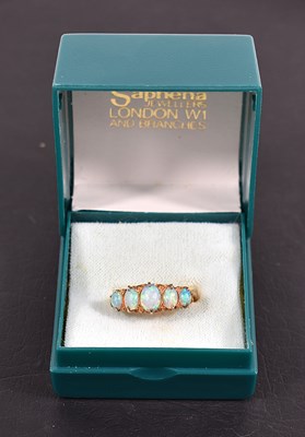 Lot 98 - An 18ct gold and opal five stone cabochon ring,...