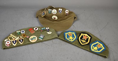 Lot 274 - A group of three Soviet era military caps...