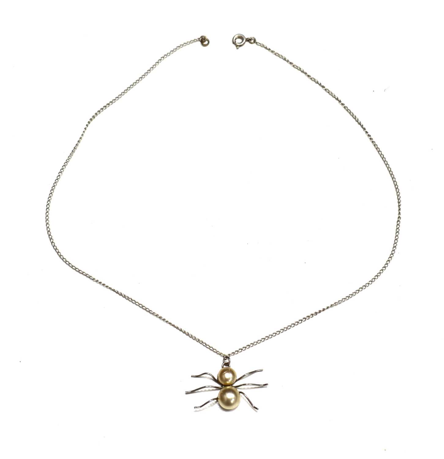 Lot 19 - A silver and pearl spider pendant necklace.