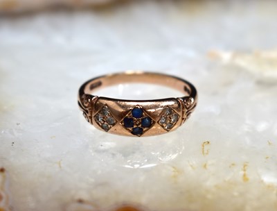 Lot 107 - A 9ct rose gold, diamonds and sapphire set...