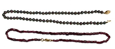 Lot 58 - A grey pearl necklace with a 9ct gold clasp...