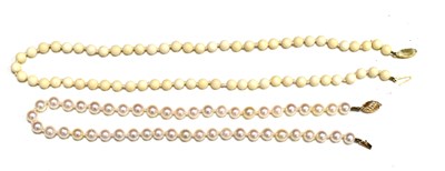 Lot 56 - Two pearl necklaces with 9ct gold clasps,...
