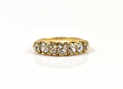 Lot 245 - A gold and seven stone diamond ring, each old...