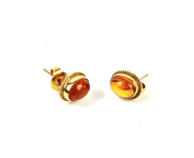 Lot 60 - A pair of 9ct gold and amber stud earrings,...