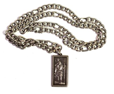 Lot 70 - A silver St Christopher pendant on a silver...