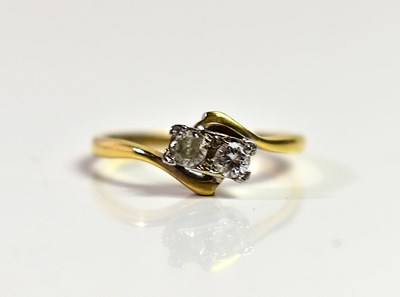 Lot 96 - An 18ct gold and two stone diamond ring, size...