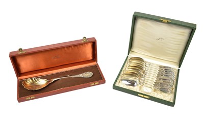 Lot 346 - A set of eleven 800 grade silver spoons and a...