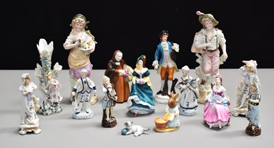 Lot 166 - A group of porcelain figures to include...