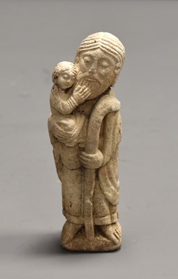 Lot 142 - A Romanesque style carved stone sculpture of...