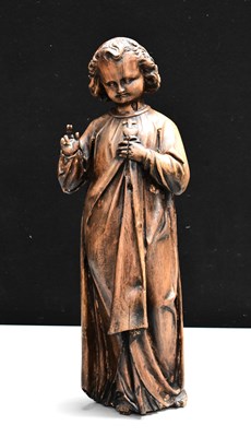 Lot 144 - An antique carved walnut sculpture of young...