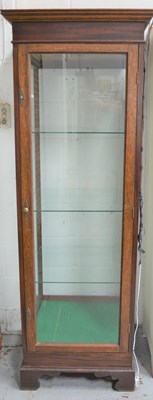 Lot 657 - A 20th century oak display cabinet, with glass...