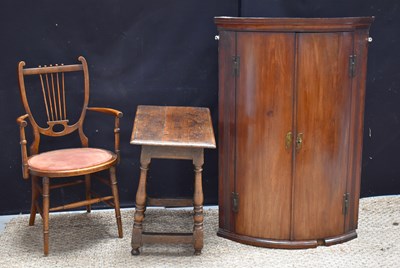 Lot 532 - A Georgian mahogany bow front corner cupboard,...