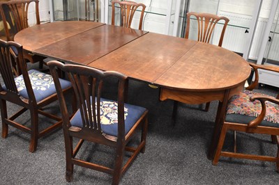 Lot 561 - A Georgian mahogany D end dining table, with...