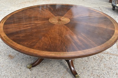 Lot 553 - A Regency style circular mahogany dining table...