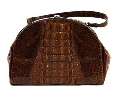 Lot 344 - A vintage crocodile skin handbag, the chrome...