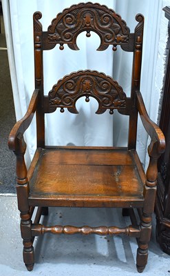 Lot 534 - A Victorian carved oak Yorkshire chair, turned...