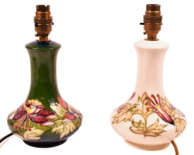 Lot 253 - Two Moorcroft pottery table lamps, one in the...