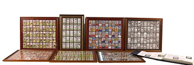 Lot 71 - A group of framed cigarette cards to include...