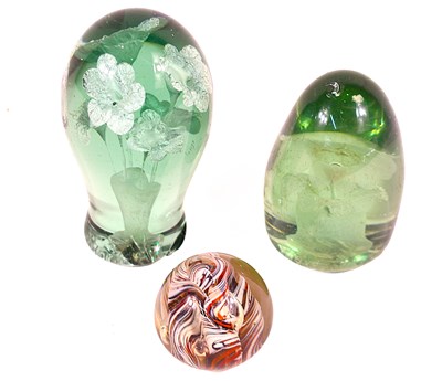 Lot 192 - Two Victorian green glass dump paperweights...