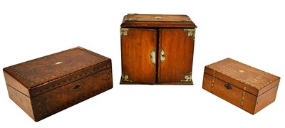 Lot 154 - A vintage oak smokers cabinet, the two doors...