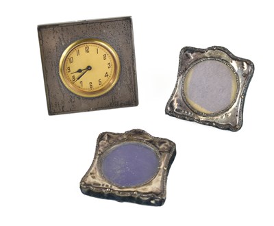 Lot 82 - An Art Deco silver framed bedside clock,...