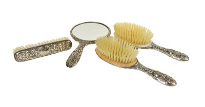 Lot 92 - A silver clad dressing table set, embossed...