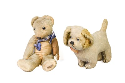 Lot 429 - A vintage Merrythought teddy bear with blue...