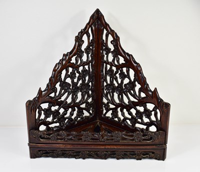 Lot 443 - A Chinese carved hardwood corner shelf...