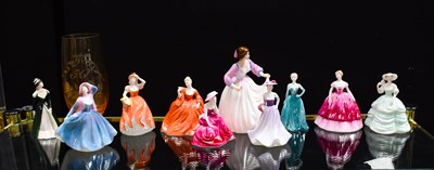 Lot 204 - A group of porcelain ladies, to include...
