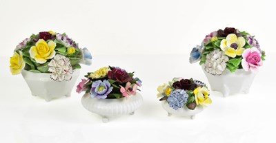 Lot 208 - A group of four Royal Doulton porcelain flower...