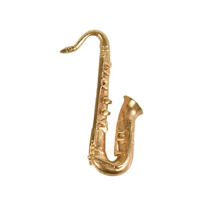 Lot 176 - A 9ct gold brooch in the form of a saxophone,...