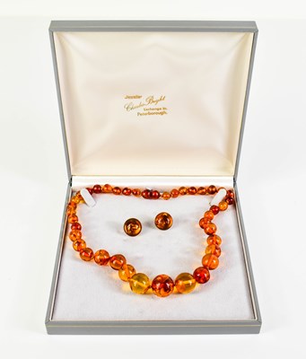Lot 142 - A pair of 9ct gold and amber earrings with...
