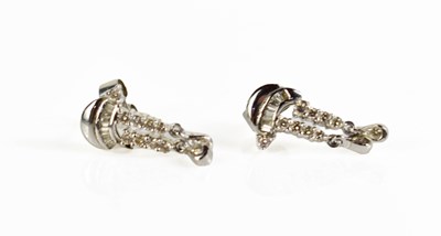 Lot 242 - A pair of white metal and diamond earrings,...
