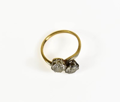 Lot 18 - An 18ct gold and diamond Toi et Moi ring, each...