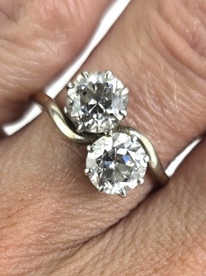 Lot 18 - An 18ct gold and diamond Toi et Moi ring, each...