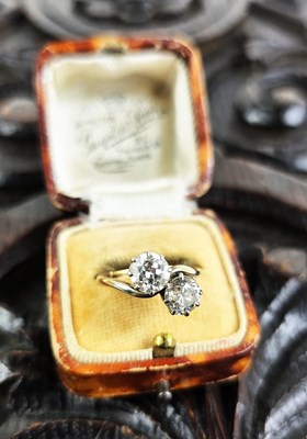 Lot 18 - An 18ct gold and diamond Toi et Moi ring, each...