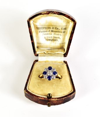 Lot 5 - An antique gold floral cluster ring featuring...
