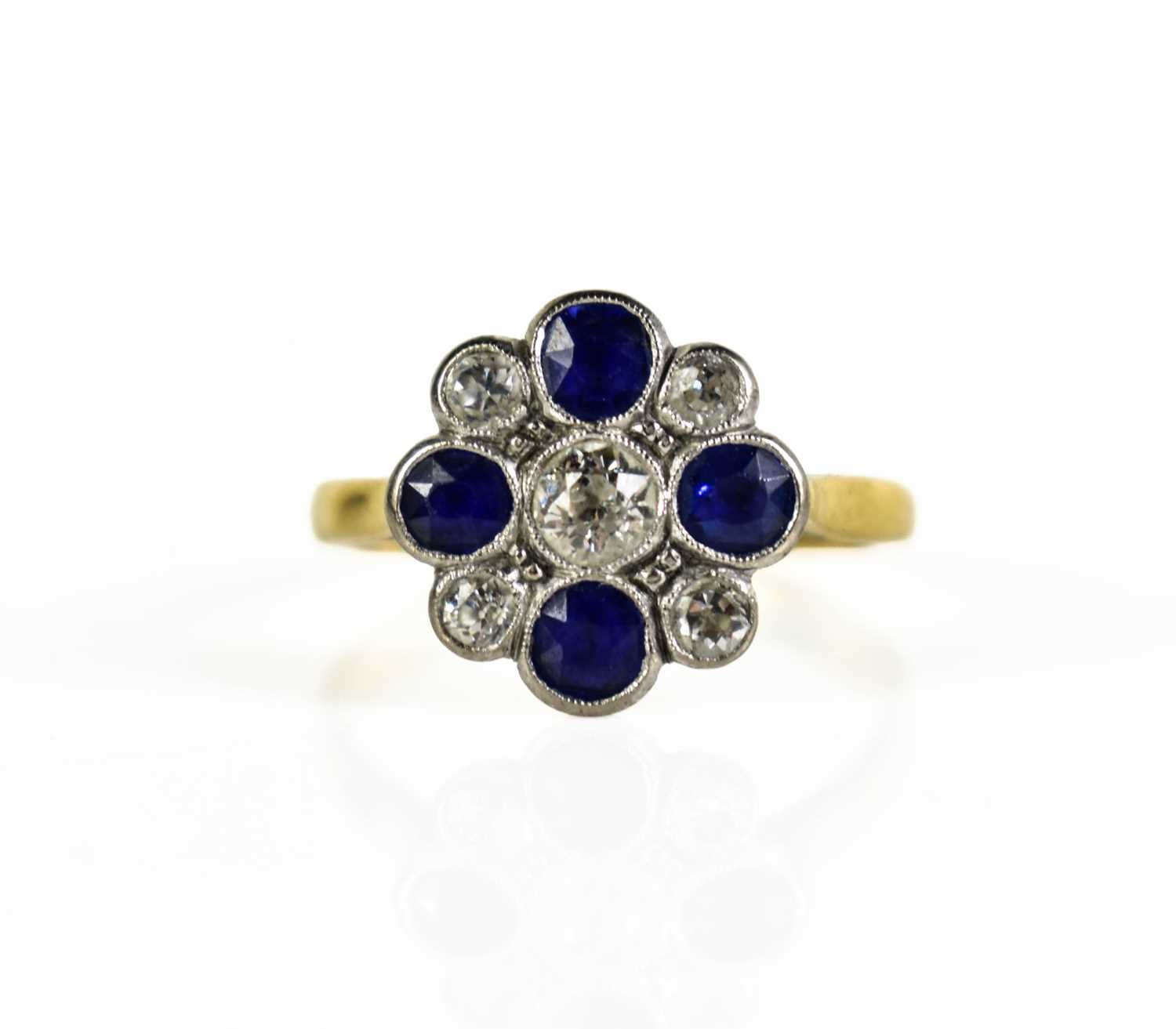 Lot 5 - An antique gold floral cluster ring featuring...
